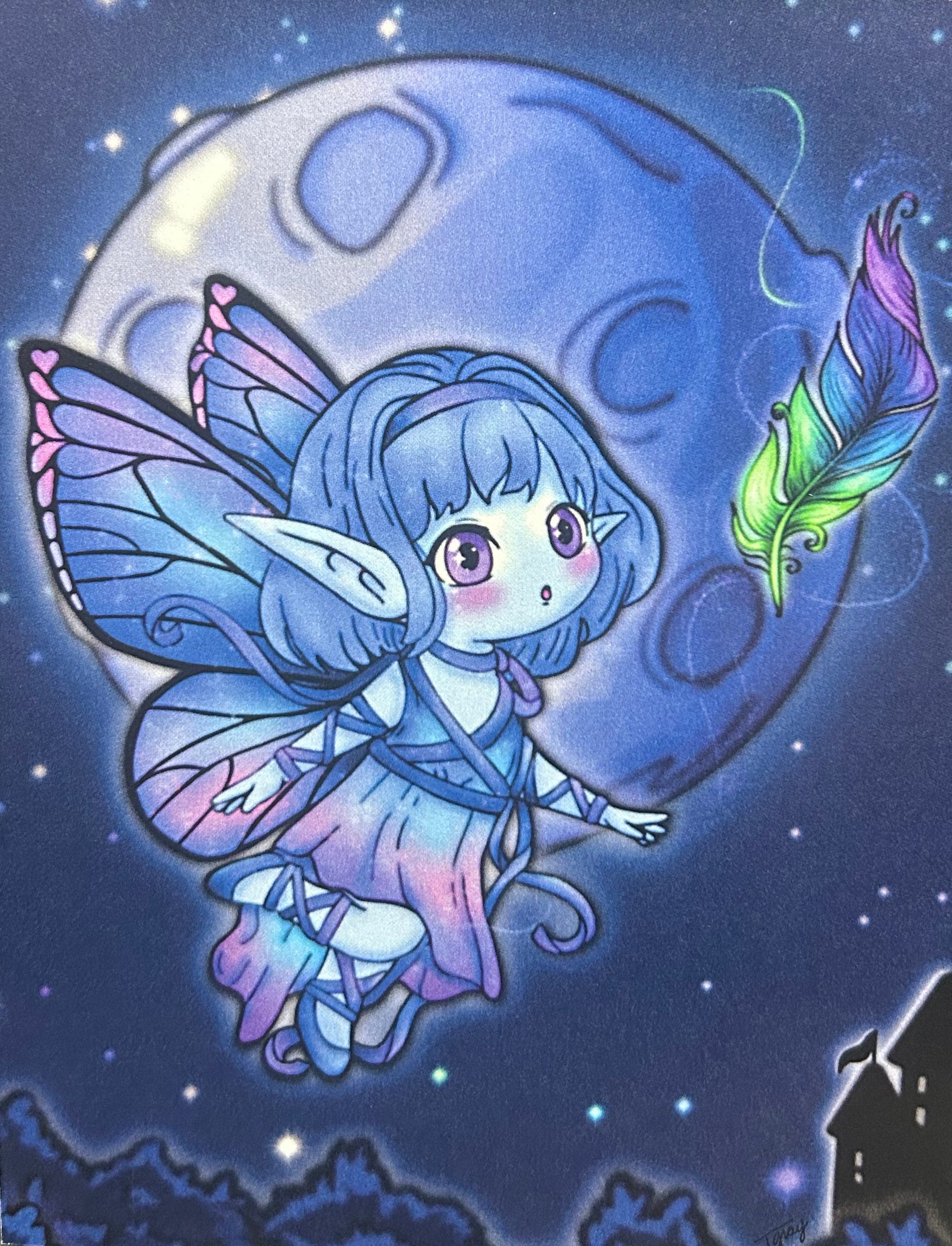 A vertical art print or card featuring a cute fantasy fairy illustration with blue hair, pink and purple wings, and a glowing moon in a starry night sky. The print is photographed standing upright against a dark gray background.